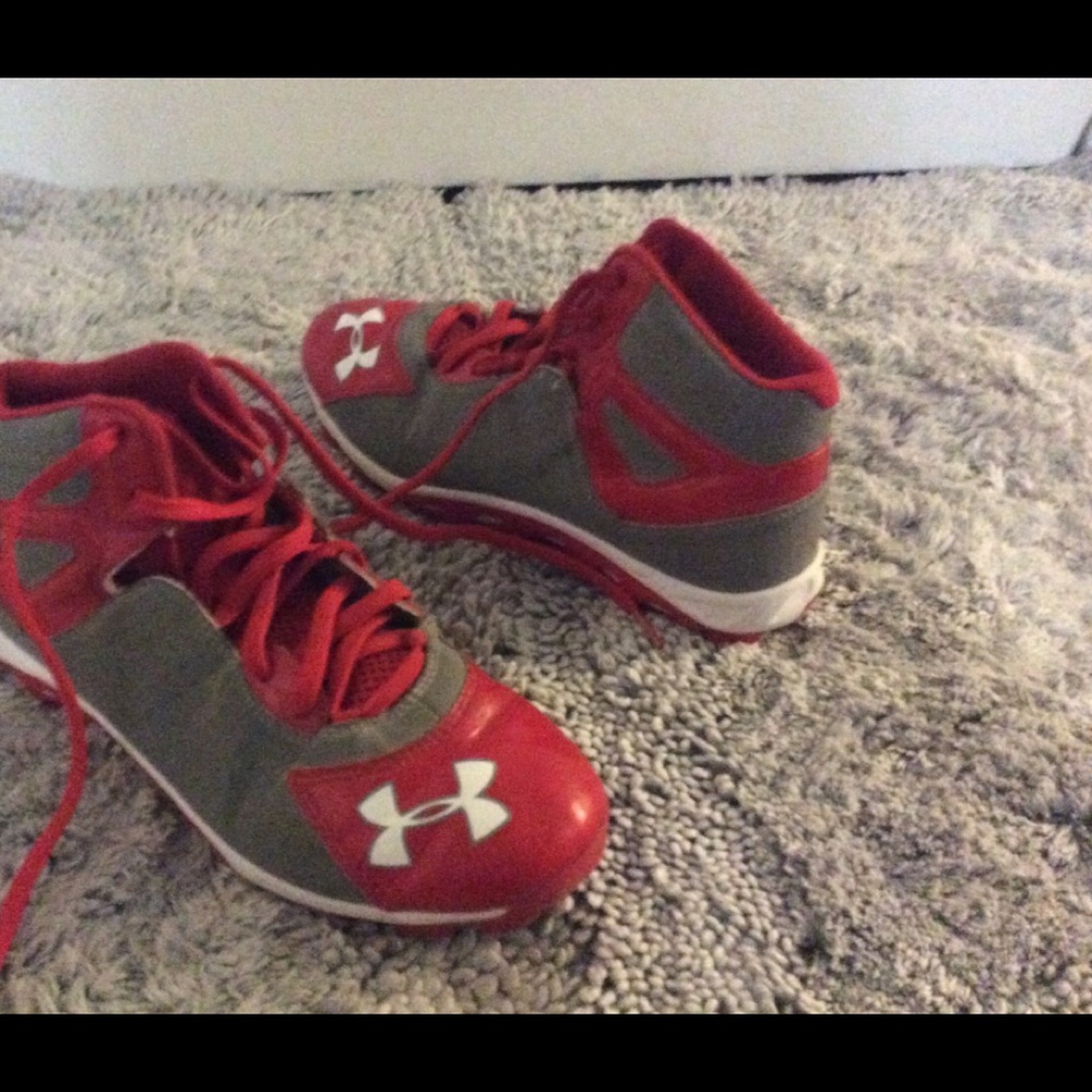 Red under amour cleats.